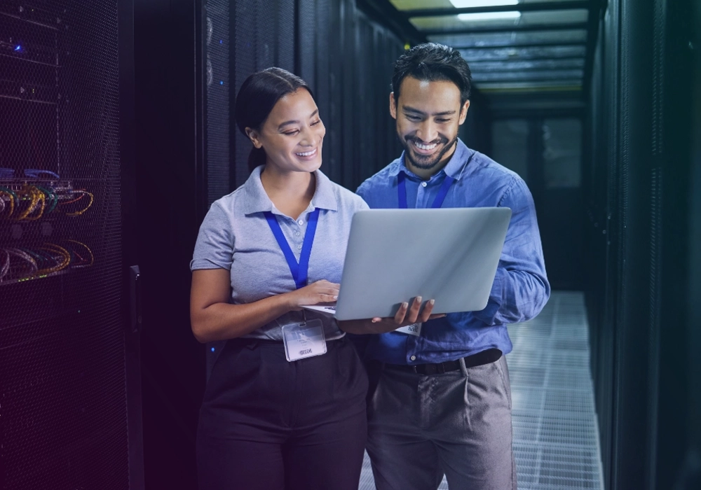 Two technicians looking at a computer